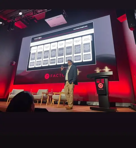 A red-lit conference stage in Melbourne